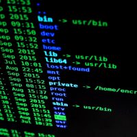 Close-up of colorful text on a computer screen, showcasing cybersecurity concepts.