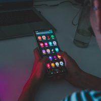 person holding black remote control