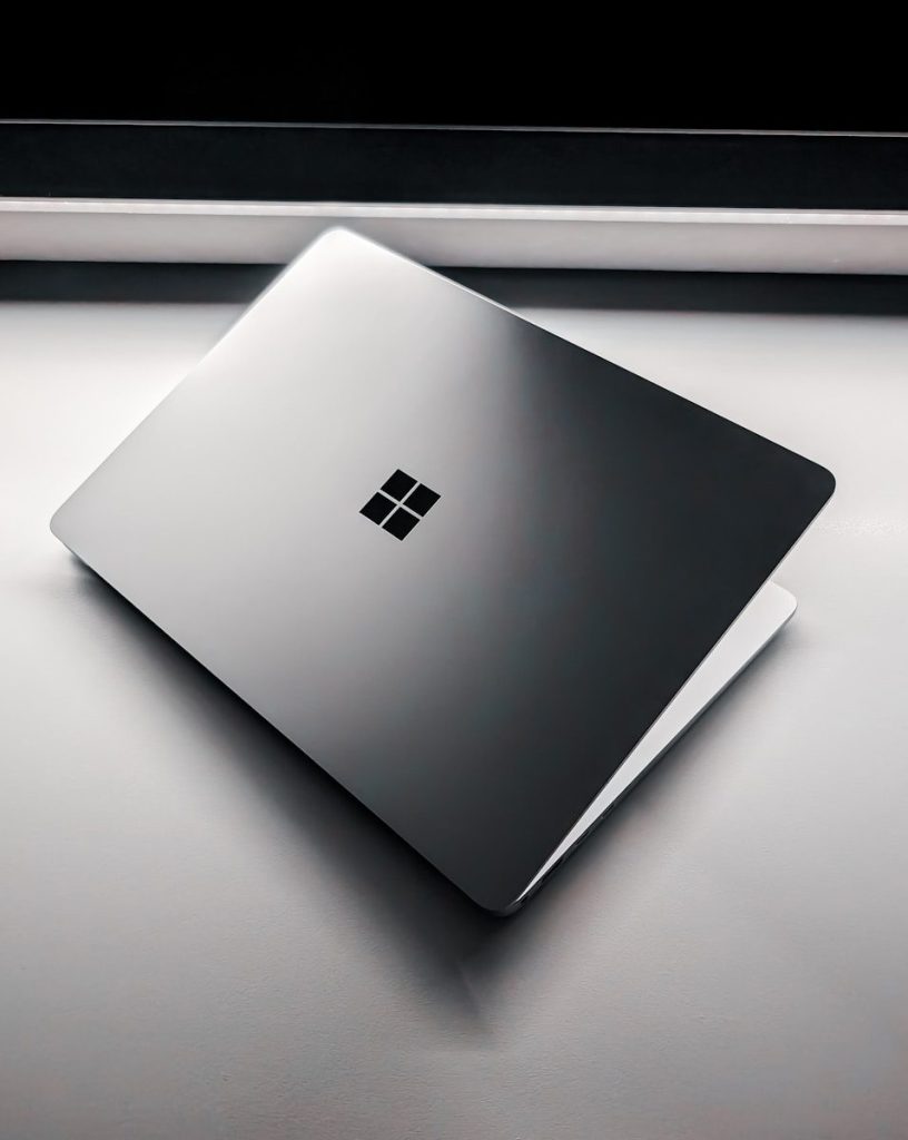 A laptop computer sitting on top of a table