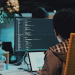 boy in front of computer monitor