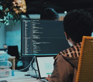 boy in front of computer monitor