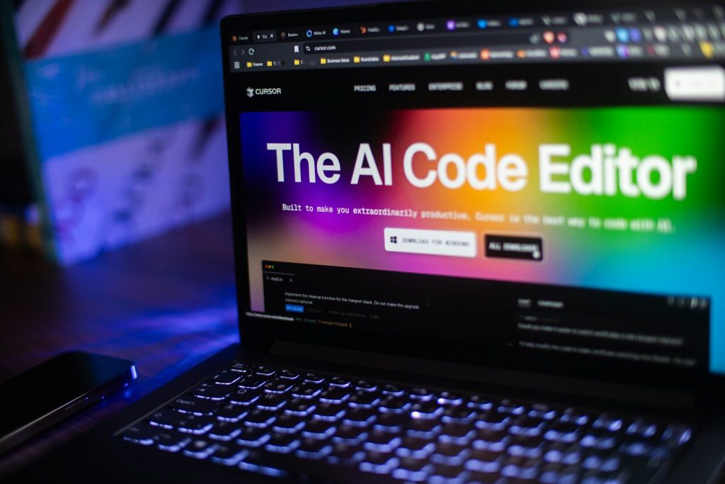Laptop displays "the ai code editor" website