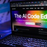 Laptop displays "the ai code editor" website