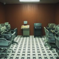 a room filled with lots of computers and desks